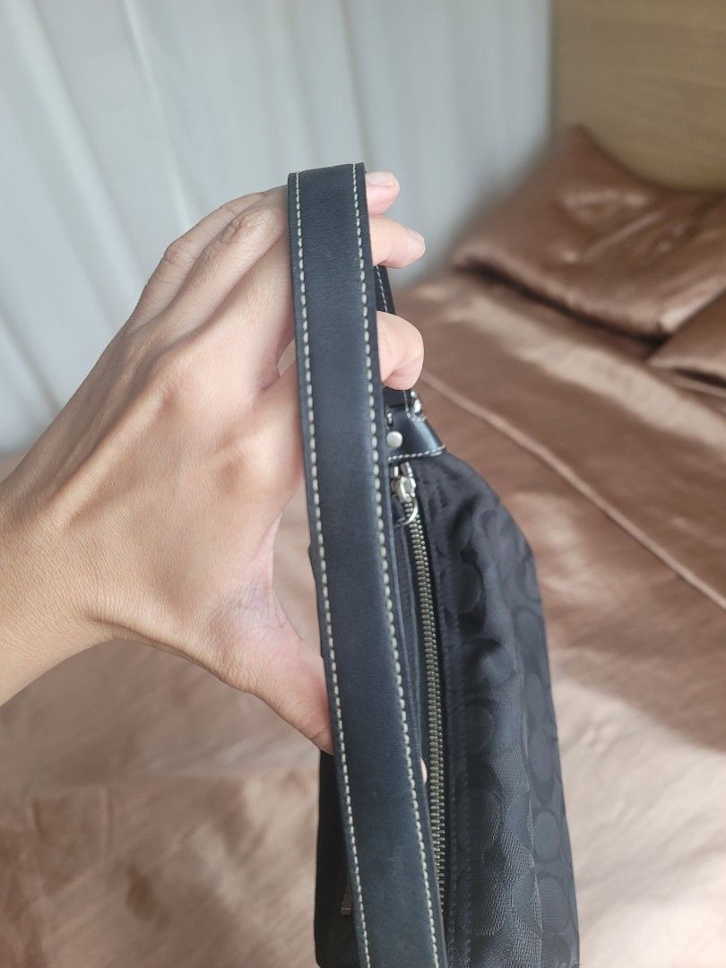 Coach Signature Black Monogram Small Shoulder Bag (Category: Luxury Bags & Wallets) located in Manila. Submitted by kamilleale02863 (Listing ID 1465460834, Image 2). Description: - Authentic Coach black shoulder bag with classic signature monogram pattern - Compact and practical size, ideal for daily essentials like phone, keys, and wallet - Secure top-zip closure to keep your belongings safe - Durable leather strap accented with polished silver 