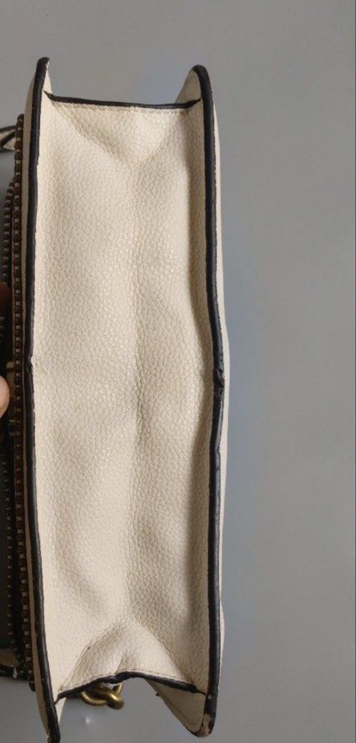 Coach Tabby Shoulder Bag White With Brass Hardware (Category: Luxury Bags & Wallets) located in Makati City. Submitted by kaydecluttersss (Listing ID 1465387132, Image 2). Description: - Brand: Coach - Style: Structured shoulder bag with top handle with detachable shoulder strap - Material: Off-white pebble grain leather with luxurious brown suede lining - Hardware: Antiqued brass with signature C pushlock closure and bead chain trim - Interior: 