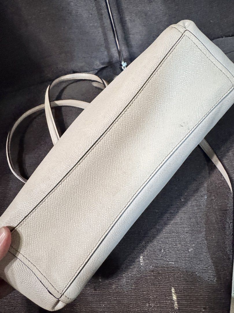 Coach white Leather Shoulder Bag Satchel (Category: Luxury Bags & Wallets) located in Manila. Submitted by dearpinkcollections (Listing ID 1465435295, Image 3). Description: - Brand: Coach - Color: white with dark brown interior lining - Material: Genuine leather with gold-tone hardware - Features: Dual top handles, detachable shoulder strap, secure zipper closure, multiple compartments, and slip pockets - Inclusions: Original Coach hangtag - Con