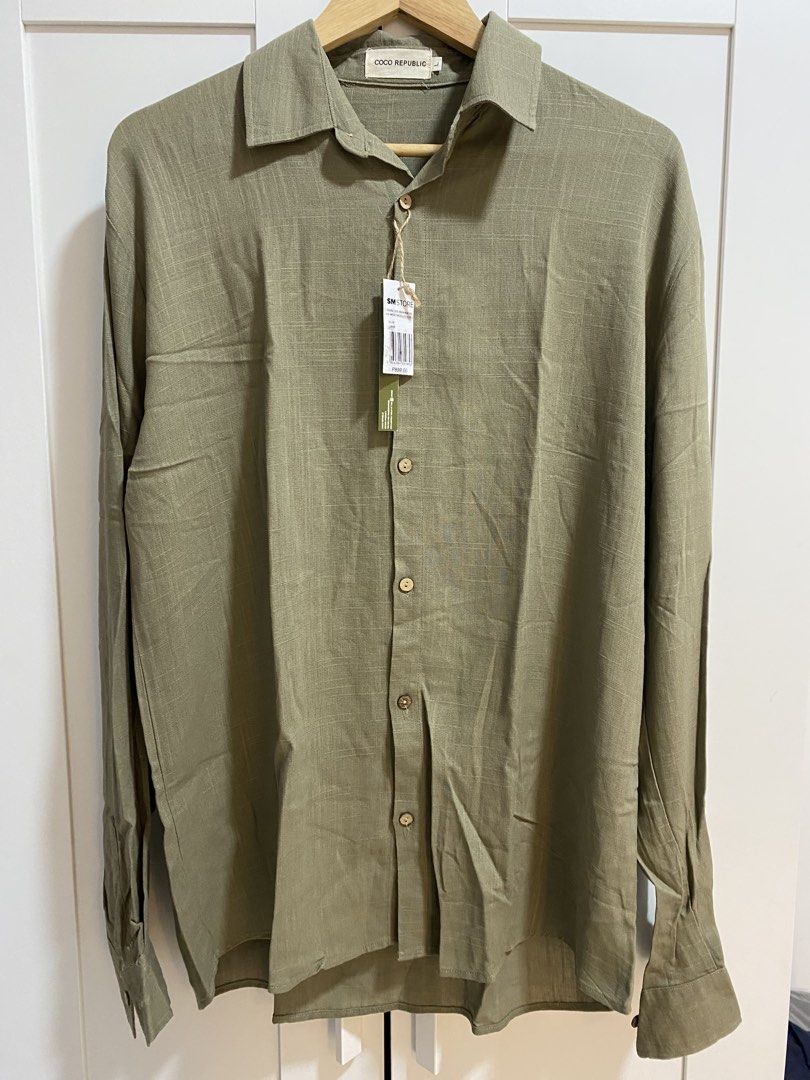 COCO REPUBLIC Olive Long Sleeve (Category: Formal Shirts) located in Quezon City. Submitted by wearhouze (Listing ID 1465478040, Image 1). Description: - Brand: Coco Republic - Color: Olive Green - Size: Large - Condition: Brand new with original SM Store tags attached, never worn - Details: Classic button-down front, structured collar, and stylish textured fabric weave.