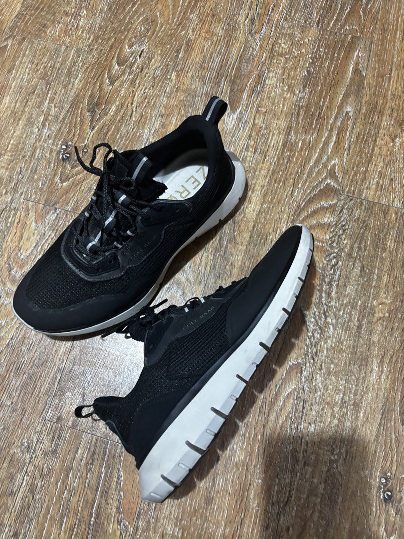 Cole Haan Zerogrand Black Running Sneakers (Category: Casual Shoes) located in San Jose del Monte. Submitted by iamiancp (Listing ID 1465507025, Image 1). Description: Cole Haan Zerogrand sneakers in black with chunky white soles. Lightweight athletic build, mesh upper material, lace-up fastening. Gold lettering on the insole. Comfortable daily trainers.Selling as pack.