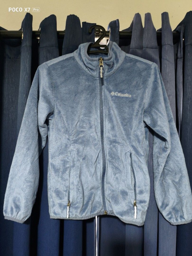 Columbia Blue Zip Up Fleece Jacket (Category: Babies & Kids Fashion) located in Cainta. Submitted by sjprelovedbotique (Listing ID 1465413778, Image 1). Description: - Brand: Columbia - Color: Pastel Blue - Material: Soft fuzzy fleece (inside and out) - Features: High collar, full front zipper, two zipped pockets, stretch cuffs - Details: White embroidered logo on the chest - Condition: Clean, worn just a few times.