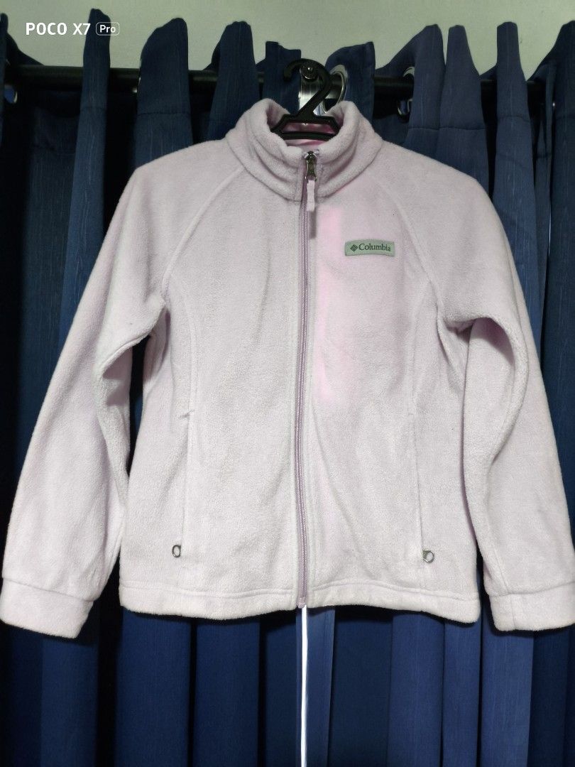 Columbia Full Zip Fleece Jacket Light Purple (Category: Babies & Kids Fashion) located in Cainta. Submitted by sjprelovedbotique (Listing ID 1465413870, Image 1). Description: - Brand: Columbia - Color: Light purple - Closure: Full front zipper with high collar - Pockets: Two secure zip pockets near the hem - Branding: Classic logo patch on the chest - Fit: Regular fit with standard length sleeves - Material: Soft, warm fabric ideal for cool weat