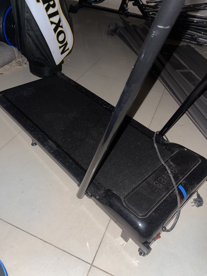 Compact Walking Treadmill with Handrail and Digital Display (Category: Cardio & Fitness Machines) located in Mandaluyong City. Submitted by lluisl (Listing ID 1465459314, Image 1). Description: - Compact black walking treadmill, perfect for home workouts - Built-in digital screen tracks basic exercise metrics - Sturdy fold-down handrail provides extra balance for walking or jogging - Slim profile easily slides under a bed or stands upright agains