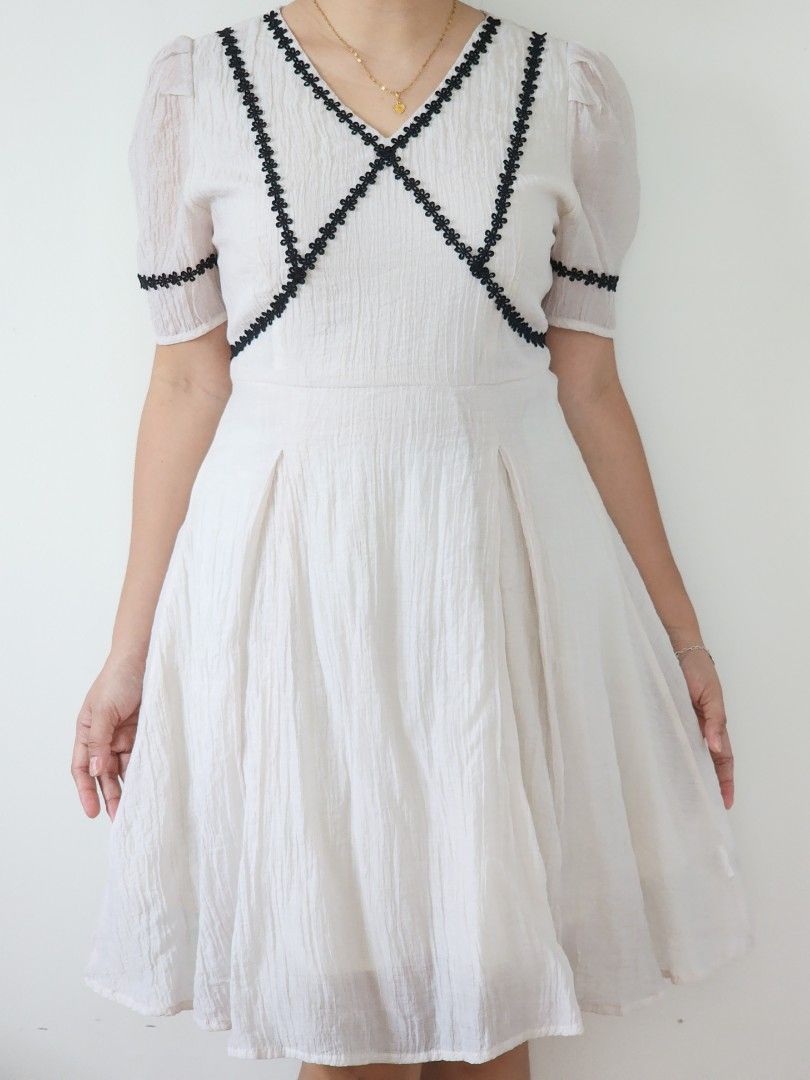 cottagecore offwhite textured mini dress (Category: Dresses) located in Batangas. Submitted by curatedbylisilaloop (Listing ID 1465433210, Image 1). Description: cottagecore offwhite textured mini dress w/ black floral lace detail | back zip | minimal stretch on skirt area Size: S-M Bust: 36" | Waist: 29" | Length: 35".