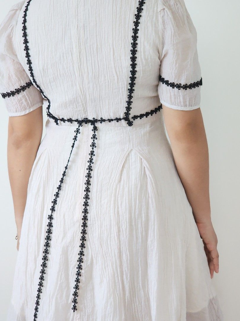 cottagecore offwhite textured mini dress (Category: Dresses) located in Batangas. Submitted by curatedbylisilaloop (Listing ID 1465433210, Image 2). Description: cottagecore offwhite textured mini dress w/ black floral lace detail | back zip | minimal stretch on skirt area Size: S-M Bust: 36" | Waist: 29" | Length: 35".