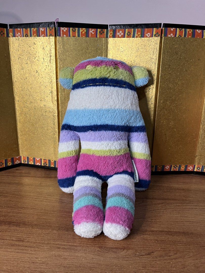 Craftholic Multi-colored Striped Plush (Category: Plushies & Soft Toys) located in Gapan. Submitted by lunashop14 (Listing ID 1465562055, Image 1). Description: - Authentic Craftholic plush toy with adorable multi-colored horizontal stripes (pink, blue, green, white, and purple) - Made with a super soft and cuddly texture, perfect for hugging or resting - Features an Accent brand tag on the side and official Craftholic tag on the front arm - Vers