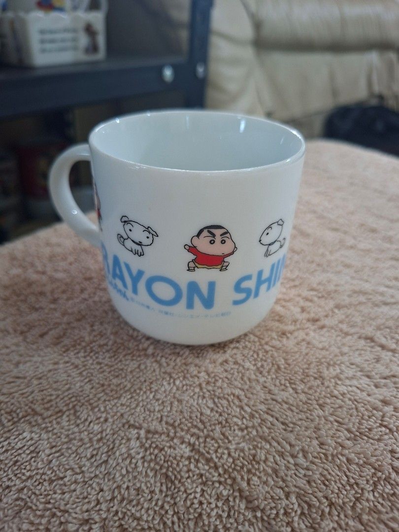 Crayon Shin Chan character Mug (Category: Coffee & Tea Tableware) located in Consolacion. Submitted by luxekerei (Listing ID 1465499943, Image 3). Description: - a vintage ceramic Crayon Shin-chan character mug featuring classic illustrations of Shin-chan and his dog Shiro alongside the series logo text..