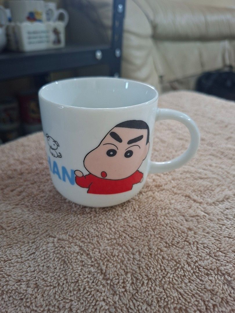 Crayon Shin Chan character Mug (Category: Coffee & Tea Tableware) located in Consolacion. Submitted by luxekerei (Listing ID 1465499943, Image 2). Description: - a vintage ceramic Crayon Shin-chan character mug featuring classic illustrations of Shin-chan and his dog Shiro alongside the series logo text..