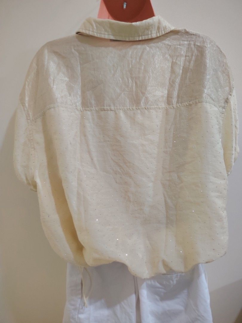 Cream Rhinestone Embellished Half-Zip Blouse Top (Category: Blouses) located in Quezon City. Submitted by timelesstreasure117 (Listing ID 1465552137, Image 3). Description: Can fit from small to medium Good condition. Side can be adjusted. ₱70 Bundle with my other top listings to get discount 5 for ₱300 10 for ₱500 Buyer books courier of choice Payment via gcash or paymaya.