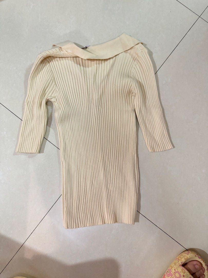 Cream Ribbed Knit Collared V-Neck Top (Category: Longsleeves) located in Quezon City. Submitted by sweetlyluxe (Listing ID 1465496841, Image 3). Description: - Color: Cream - Style: Ribbed knit top with collar and V-neckline - Fit: Fitted cut with long sleeves - Material: Soft and stretchy fabric - Condition: Brand new with tag still attached - Versatile: Easy to match with jeans or skirts for officef corporate work.
