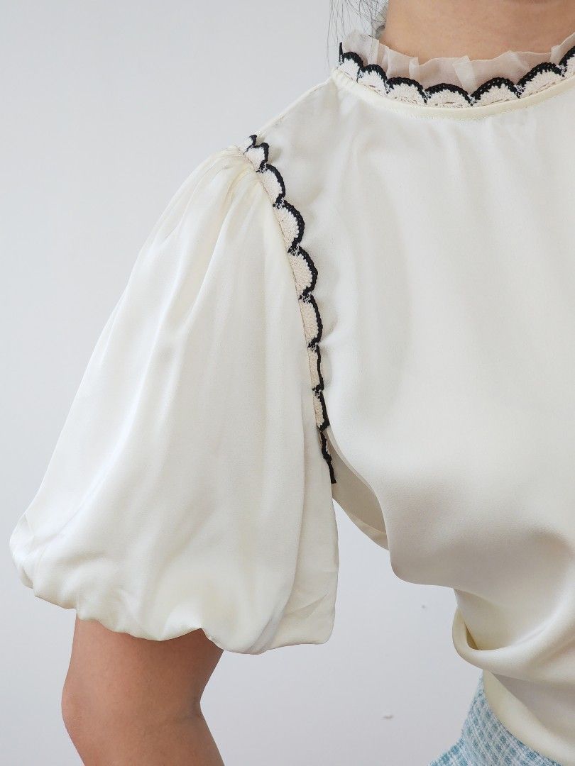 cream satin puff sleeve top (Category: Blouses) located in Batangas. Submitted by curatedbylisilaloop (Listing ID 1465431134, Image 2). Description: fave! instant chic 🤍 | cream satin puff sleeve top with scalloped lace trim details Size: freesize Bust: 38".