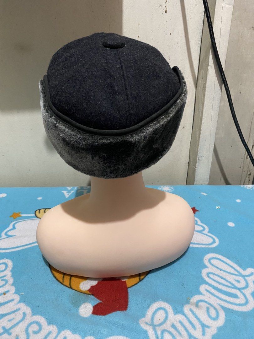 Dark Grey Wool Winter Hat with Ear Flaps and N Logo (Category: Caps & Hats) located in Manila. Submitted by resi.diaz (Listing ID 1465433806, Image 2). Description: - Color: Dark grey - Material: Wool with plush faux fur ear flaps - Details: Features a chic silver letter N pin on the front left - Design: Structured visor brim and fold-down ear flaps for extra warmth - Condition: Clean fabric and sturdy construction - Best for: Cold weather and wi