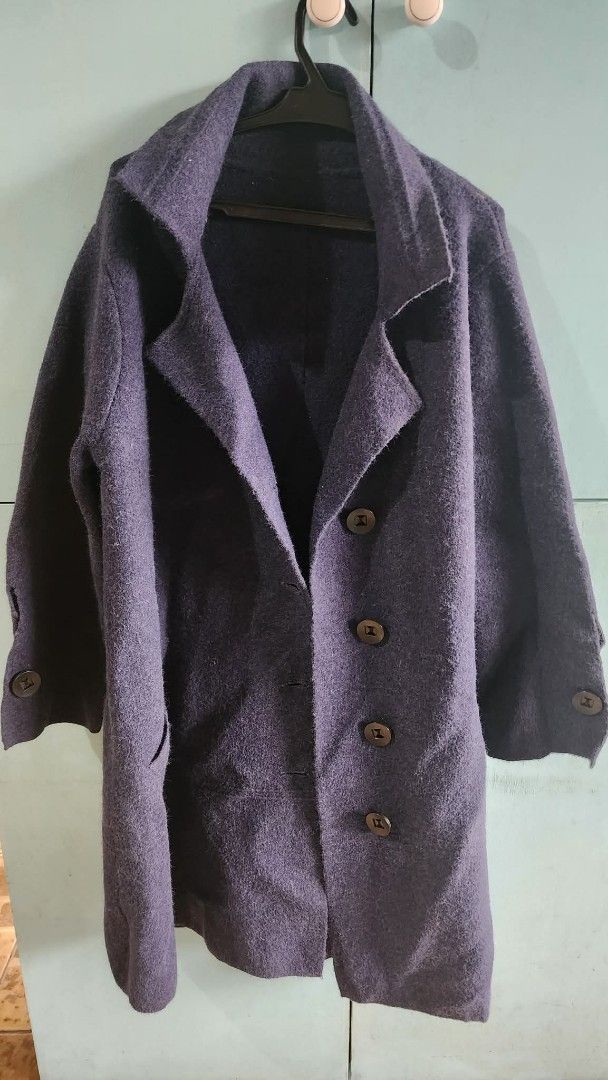 Dark Purple Wool Overcoat with Buttons (Category: Coats, Jackets and Outerwear) located in Paranaque City. Submitted by yumme (Listing ID 1465469351, Image 3). Description: - Dark purple wool-blend overcoat - Classic lapel collar with front button closure - Mid-length cut for extra warmth - Long sleeves with buttoned cuffs - Textured solid fabric finish - Perfect cozy layer for the winter season.