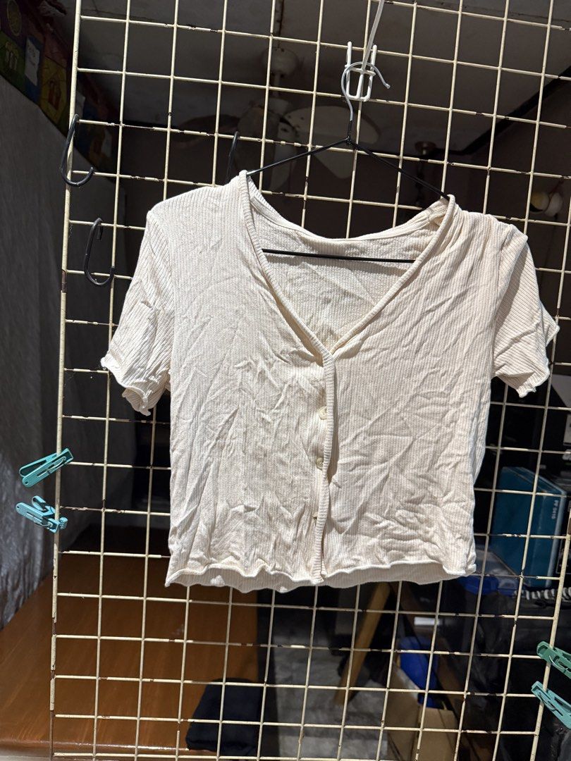 DAZY Beige Ribbed Crop Top Size L (Category: Sleeveless) located in Quezon City. Submitted by nsseller (Listing ID 1465507235, Image 1). Description: - Brand: DAZY - Color: Beige - Size: L (Made in China) - Material: Lightweight and stretchy ribbed knit - Design: V-neck with functional front buttons and trendy lettuce hem - Perfect for casual OOTDs and easy to pair with high-waist jeans or skirts!.