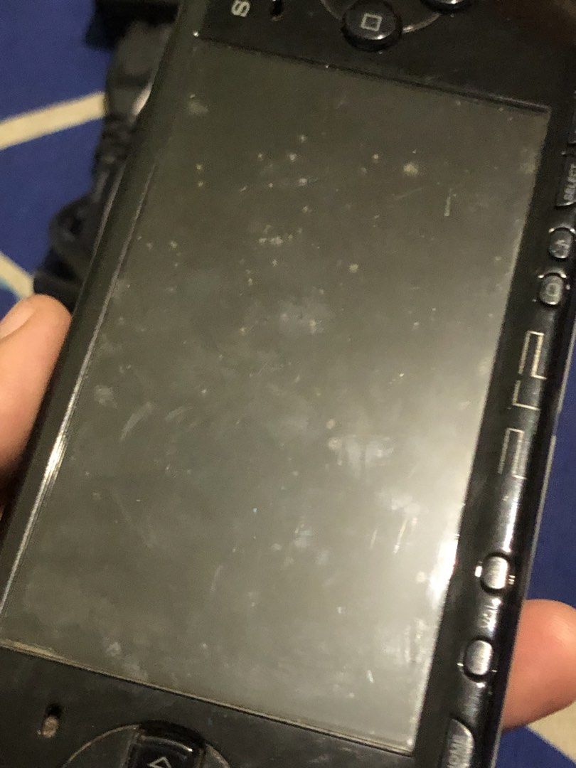 Defective PSP 2004 set (Category: PlayStation) located in Quezon City. Submitted by markgolveo (Listing ID 1465481535, Image 3). Description: Defective unit Tried plugging in adapter not powering on , plugged it before it powered abit but as of now no response Spots on screen seems like mold Latch lock on battery port broken as shown on images Inclusions of PSP unit 2004 model Authentic adapter umd disc tekken dark ressurection Low capacity mem c