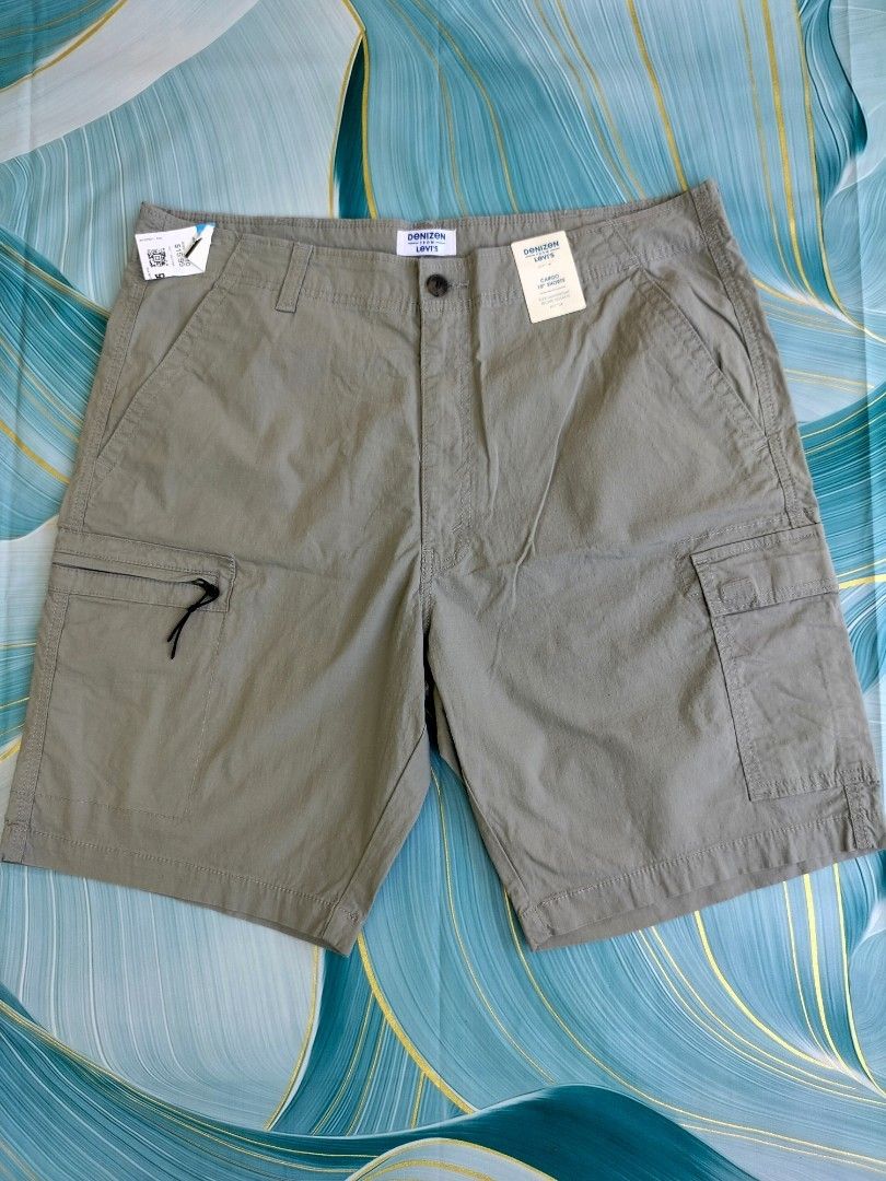 Denizen from Levi's Cargo 10" Shorts W38 (Category: Shorts) located in Manila. Submitted by gerald_quinto (Listing ID 1465482649, Image 1). Description: - Brand: Denizen from Levi's - Style: Cargo shorts - Color: Grey - Size: W38 - Fabric: Flex lightweight material for ultimate comfort - Pockets: Multiple utility pockets including secure zipped and flap compartments - Condition: Brand new with original retail tags attached, includes brand tag at 