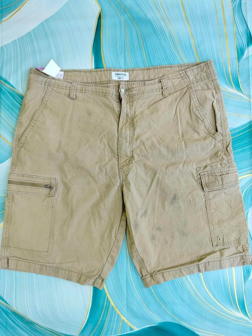Denizen from Levi's Khaki Cargo Shorts Size 40 (Category: Shorts) located in Manila. Submitted by virgiliosa38485 (Listing ID 1465504751, Image 1). Description: - Brand: Denizen from Levi's - Color: Khaki - Size: Waist 40 (180/102C) -Length 22.5 - Fit: Regular fit, classic everyday style - Material: Easy-to-wash cotton blend - Pockets: Multiple utility pockets with secure zipper and button flap styles - Condition: Excellent/Ready to wear.