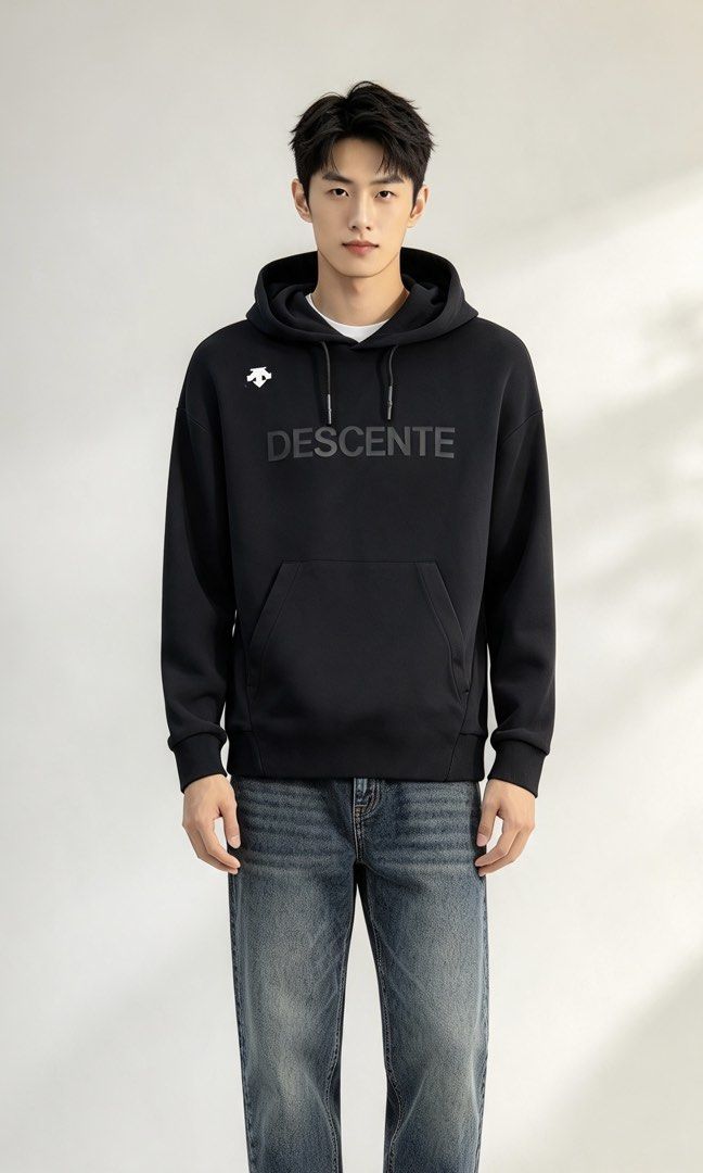 Descente Black Pullover Hoodie Size M (Category: Hoodies) located in Paranaque City. Submitted by mykapoynton (Listing ID 1465545132, Image 1). Description: Descente Black Pullover Hoodie Size M - Color: Black with white logo and tonal front lettering - Size: 165/84A (Medium) - Material: 78% cotton, 16% polyester, 6% spandex - Features: Front kangaroo pocket, drawstring hood - Condition: Clean inside and out, minimal wear.