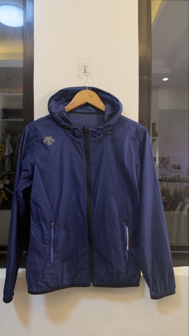 DESCENTE Hooded Windbreaker Jacket Blue (Category: Coats, Jackets and Outerwear) located in Paranaque City. Submitted by mykapoynton (Listing ID 1465544667, Image 2). Description: DESCENTE Hooded Windbreaker Jacket Blue - Color: Blue - Style: Lightweight windbreaker jacket with full zip and attached hood - Pockets: Two secure zippered hand pockets - Details: Elastic cuffs and hem for a snug fit - Size: Women's M (US 6, IT 46) - Condition: Clean i