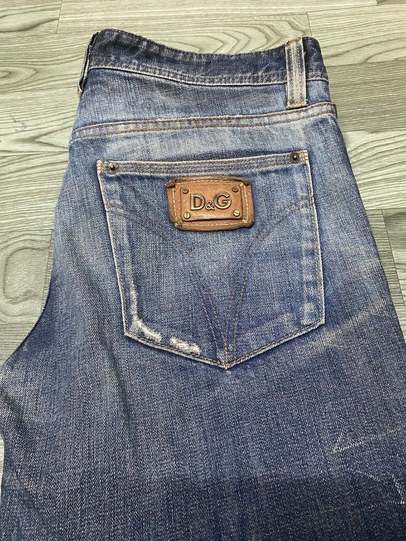 D&G Dolce & Gabbana Audacious Jeans (Category: Jeans) located in Pasig City. Submitted by jstnisidor81288 (Listing ID 1465502308, Image 3). Description: D&G Dolce & Gabbana denim jeans from the Audacious line. Regular rise with tight legs. Factory distressed wash pattern on the front with heavy fading. Leather D&G logo patch on the back pocket. Made in Tunisia. 100 percent cotton construction. Button fly closure..