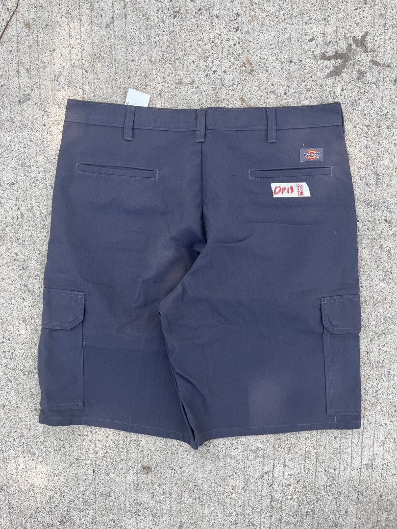 Dickies Cargo Charcoal Work Pants Size 36x22 LO12 (Category: Trousers) located in Cebu City. Submitted by guttathreads (Listing ID 1465458555, Image 1). Description: - Brand: Dickies - Color: Charcoal grey - Size: Waist 35 - Material: 65% polyester, 35% cotton - Origin: Made in Guatemala - Condition: Brand new with tags and inside care instructions - Style: Solid dark color, ideal for everyday workwear or casual use.