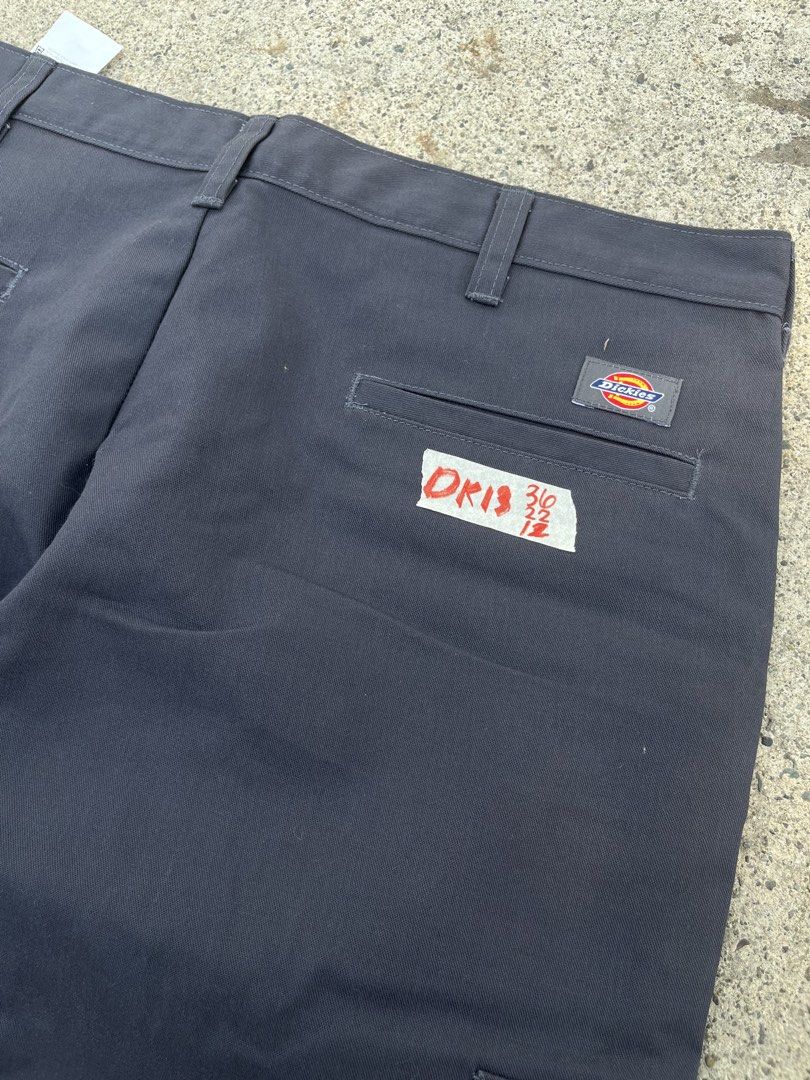 Dickies Cargo Charcoal Work Pants Size 36x22 LO12 (Category: Trousers) located in Cebu City. Submitted by guttathreads (Listing ID 1465458555, Image 3). Description: - Brand: Dickies - Color: Charcoal grey - Size: Waist 35 - Material: 65% polyester, 35% cotton - Origin: Made in Guatemala - Condition: Brand new with tags and inside care instructions - Style: Solid dark color, ideal for everyday workwear or casual use.