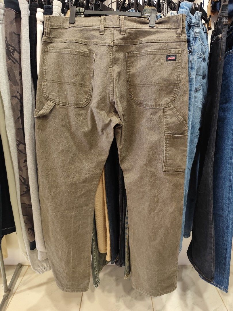 Dickies Cargo Pants Olive Green Size 36x32 (Category: Trousers) located in Puerto Princesa. Submitted by secondhand_bliss (Listing ID 1465437396, Image 2). Description: - Brand: Dickies - Color: Olive green - Size: 36" waist, 32" inseam - Material: Sturdy cotton blend with stretch for comfort - Fit: Regular fit, great for everyday workwear - Features: Multiple utility pockets, side hammer loop, branded button closure, and genuine Dickies patch - 