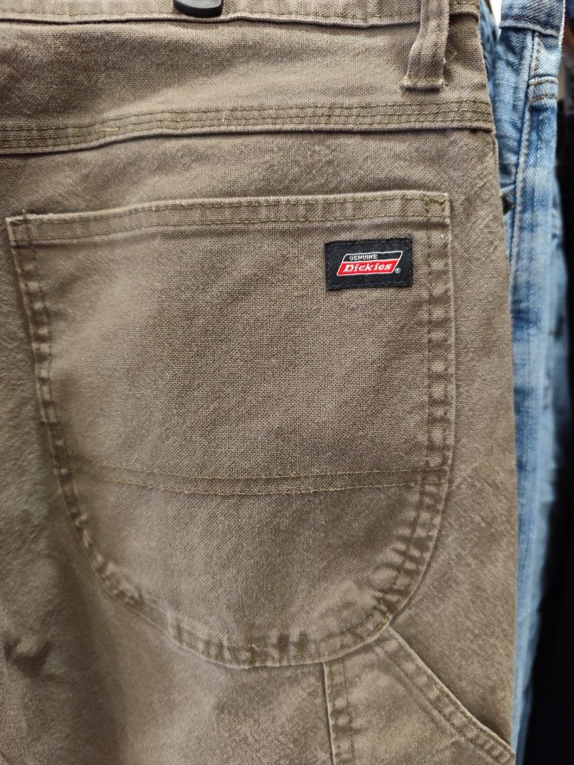 Dickies Cargo Pants Olive Green Size 36x32 (Category: Trousers) located in Puerto Princesa. Submitted by secondhand_bliss (Listing ID 1465437396, Image 3). Description: - Brand: Dickies - Color: Olive green - Size: 36" waist, 32" inseam - Material: Sturdy cotton blend with stretch for comfort - Fit: Regular fit, great for everyday workwear - Features: Multiple utility pockets, side hammer loop, branded button closure, and genuine Dickies patch - 