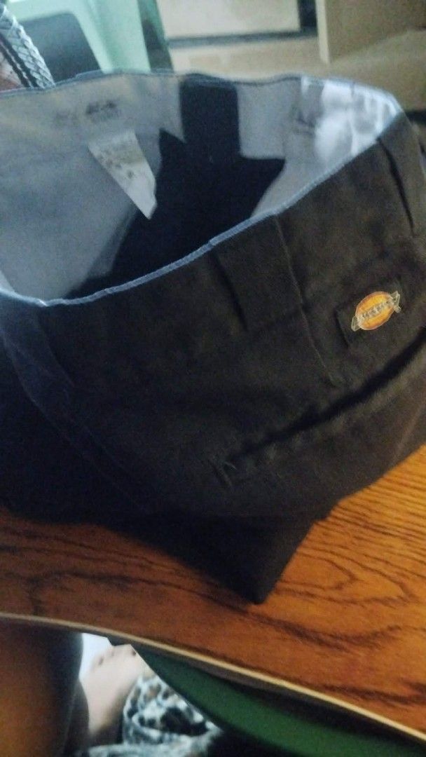 Dickies Work Pants (Category: Trousers) located in Manila. Submitted by lawrence_escutin (Listing ID 1465547947, Image 1). Description: - Size: 30 on tag 31 waist on dime - Color: navy blue - Brand: Dickies - Classic workwear style with standard belt loops - Features rear welt pockets and signature logo patch above the right pocket - Durable, heavy-duty fabric built for daily wear.