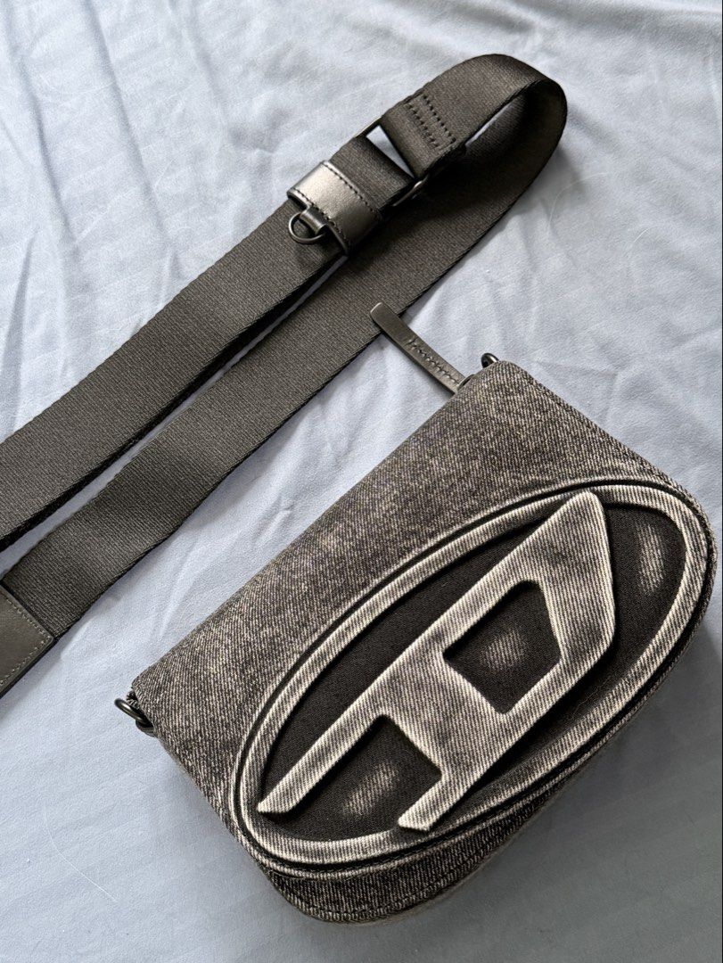 Diesel 1DR Camera Bag with Sling (Category: Cross-body Bags) located in Quezon City. Submitted by succubusjpn (Listing ID 1461824127, Image 1). Description: Diesel 1DR Camera Bag with Sling in washed denim No issues Used 3 times only Complete with Dustbag, Authenticity Cards and Tags Excellent Condition (9.5/10) Imported from Italy (With Email confirmation receipt) .