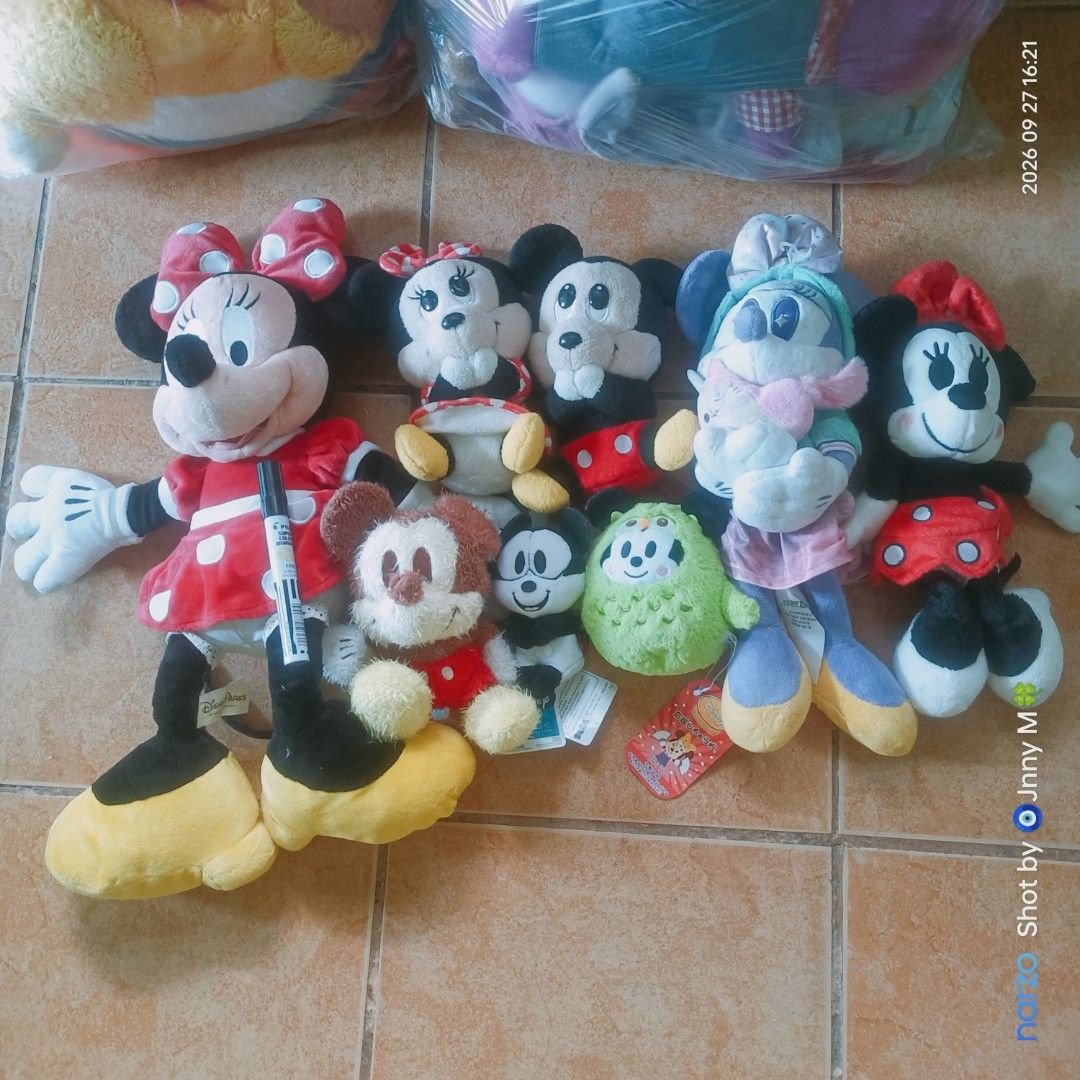 Disney Mickey and Minnie Mouse plush toy collection bundle (Category: Plushies & Soft Toys) located in Taguig. Submitted by mhayestufftoys (Listing ID 1465437393, Image 1). Description: - Assorted Disney plush toy bundle featuring Mickey and Minnie Mouse in various outfits - Includes a bonus green creature character - Variety of sizes and styles: sitting, standing, and small keychain plushies - Clean fabrics and well-maintained condition - Ideal 