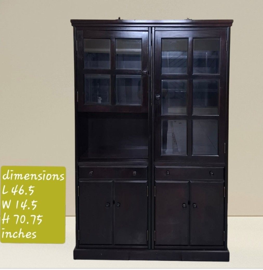 Display Hutch Storage Cabinet Platera Bookcase (Category: Shelves, Cabinets & Racks) located in Quezon City. Submitted by dannikkishoppe2 (Listing ID 1465385085, Image 1). Description: Display Hutch Storage Cabinet Platera Bookcase‼️₱11000‼️ • Finish: Deep brown with visible wood joinery • Dimensions: 46.5"L x 14.5"W x 70.75"H • Upper Section: Glass-paneled doors with interior shelves for display • Middle Section: Two functional pull-out drawers 