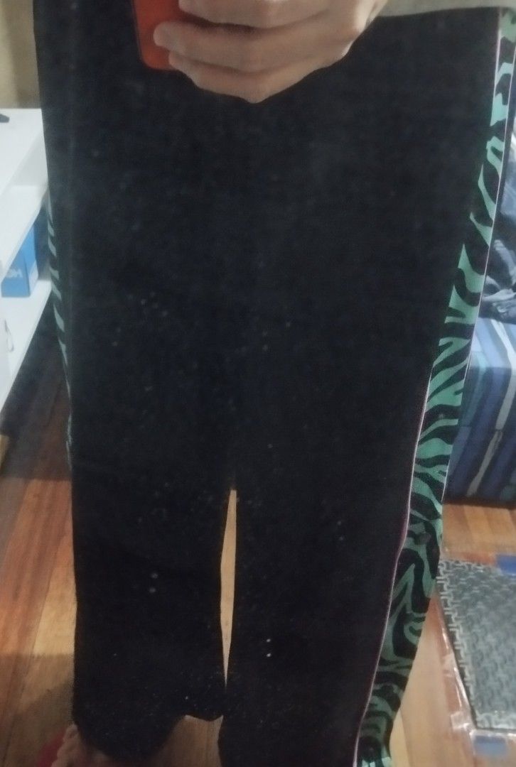 Divided H&M Black Track Pants Green Zebra Side Snaps (Category: Other Bottoms) located in Manila. Submitted by lene48 (Listing ID 1465472039, Image 2). Description: - Brand: Divided - Color: Black with green/black zebra print panels and pink piping - Features: Functional snap buttons along the outer legs - Fit: Comfortable elastic waistband, relaxed fit - Style: Retro sportswear, perfect statement piece for casual outfits - Condition: Excellent /