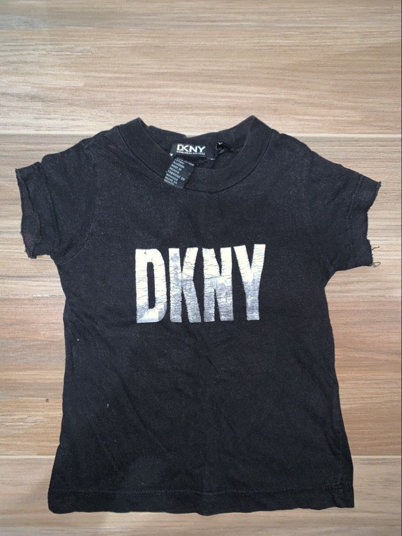 DKNY Black Logo T-Shirt (Category: Shirts) located in Antipolo. Submitted by _ni3lly (Listing ID 1465479950, Image 1). Description: - Brand: DKNY (Donna Karan New York) - Color: Classic Black - Size: Standard Fit (Tag intact) - Material: 100% Cotton, Made in Mexico.