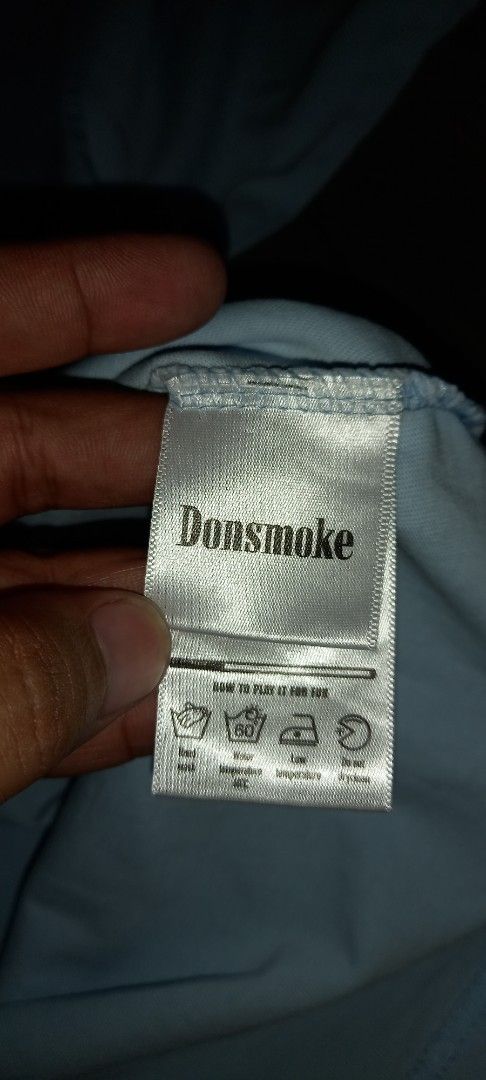 Donsmoke I Don't Smoke (Category: Tshirts & Polo Shirts ) located in Imus. Submitted by pampie (Listing ID 1465554041, Image 3). Description: - Brand/Model: Authentic Donsmoke t-shirt - Color: Light blue with bold white 'I DON'T SMOKE' front graphic - Material: 100% breathable cotton - Size: Medium (Tag on collar) - Measurements: Approx. 22" width x 29" length - Special Detail: Fun graphic text on the inner care label - Care Instructions: Machine