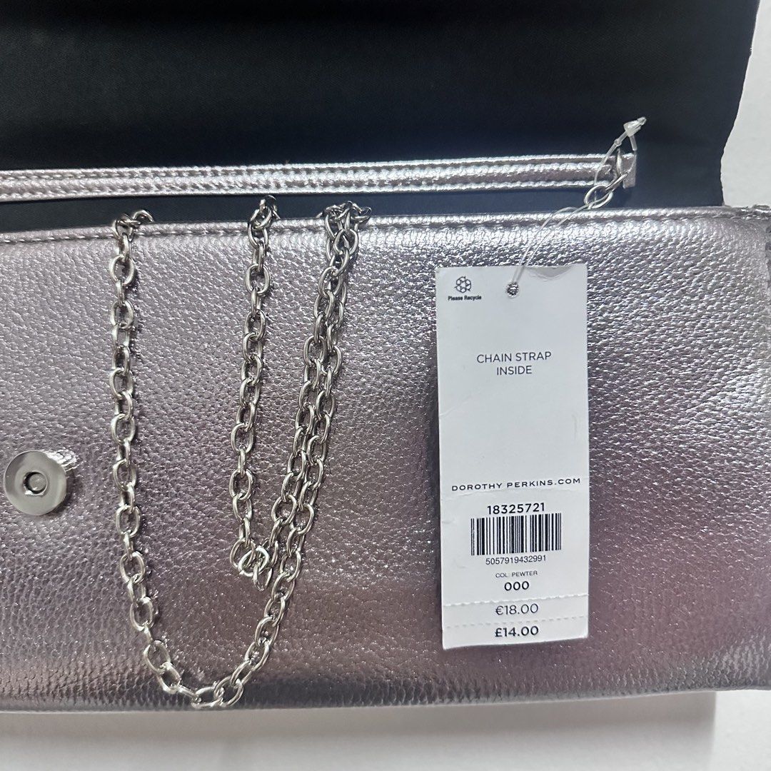 Dorothy Perkins Silver Metallic Envelope Clutch Bag (Category: Luxury Bags & Wallets) located in Valenzuela. Submitted by refined.finds (Listing ID 1465551321, Image 3). Description: Please READ including Mailing & Delivery ‼️ Dorothy Perkins Metallic Evening Clutch / Sling Bag Condition: Unused Dorothy Perkins evening clutch with original tag still attached. Features a metallic silver finish with sleek metal detailing — perfect for weddings, par