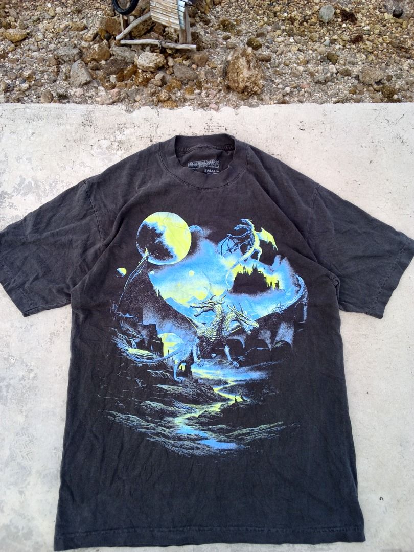 Dragon Graphic T-Shirt Small (Category: Tshirts & Polo Shirts ) located in Caloocan City. Submitted by mysticdog-6a6b (Listing ID 1465451484, Image 1). Description: - Color: Faded washed charcoal black - Size: Small - Design: Fantasy dragon and moon graphic print on the front - Cut: Classic crew neck - Condition: Pre-owned with a vintage faded look.