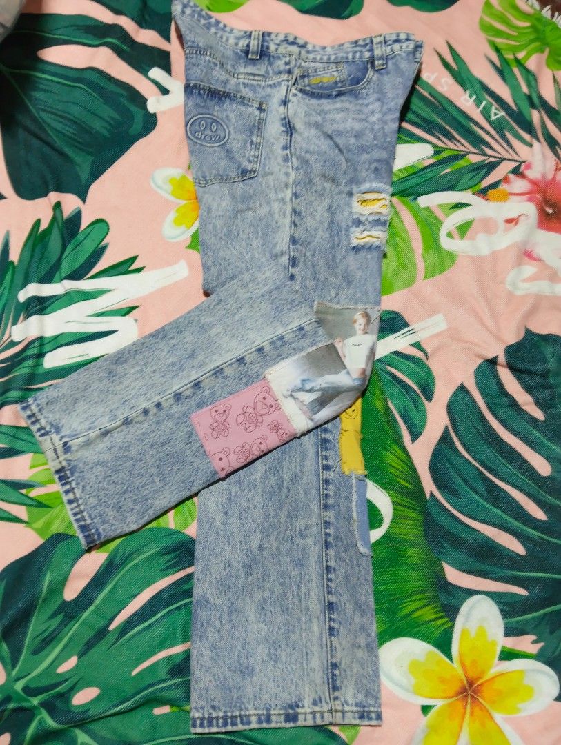 drew house patchwork acid wash denim jeans size 34 (Category: Jeans) located in Davao. Submitted by noelamihan05424 (Listing ID 1465459473, Image 3). Description: - Brand: Drew House - Size: 34 (Straight leg cut) - Waist 34 - Thigh 12 - Hem 9 - Length 41 - Material: 100% Cotton, acid wash finish - Design: Unique mixed fabric patches, photo prints, and smiley face patterns with distressed details - Details: Yellow embroidered Drew House logo lette