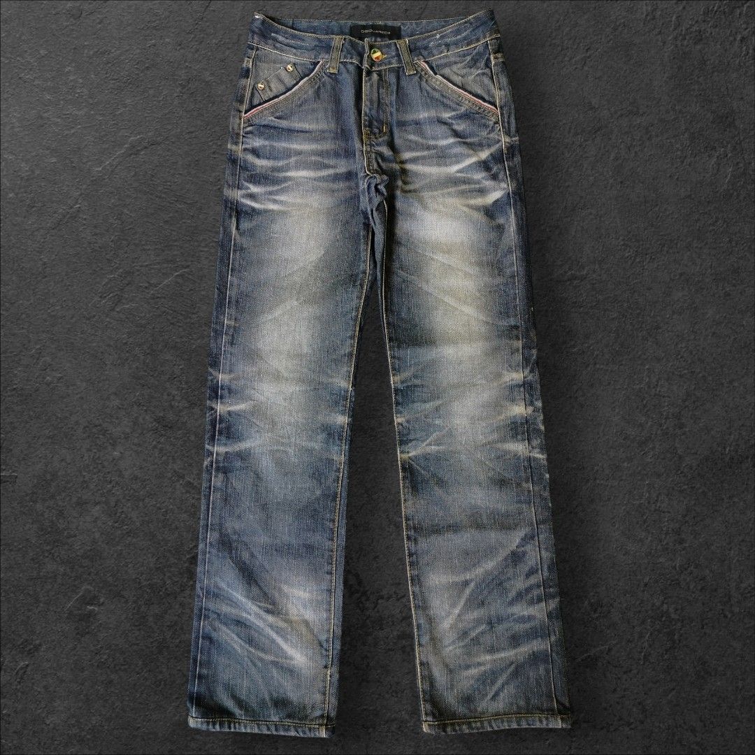 Dsquared2 Flavor Distressed Denim Jeans (Category: Jeans) located in Manila. Submitted by gerald_quinto (Listing ID 1465476701, Image 2). Description: - Brand: Dsquared2 -Size 28-29 -Length 39 -Hem 7 - Style: Vintage-wash straight leg jeans with heavy distressing and whiskering - Pockets: Classic 5-pocket styling with unique angled front pockets and contrast red and white stitching - Details: Branded leather back patch and large round embroidered