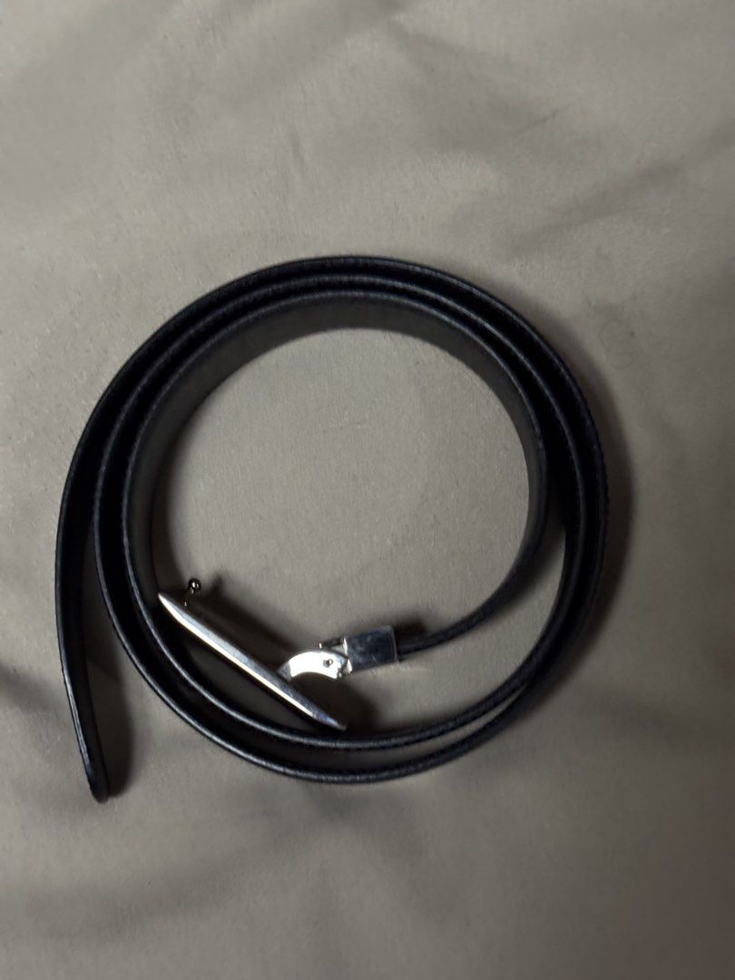 Dunhill Black Leather Belt with Silver Buckle (Category: Belts) located in Manila. Submitted by seangoart (Listing ID 1465530674, Image 2). Description: - Brand: Dunhill - Material: Premium black leather with classic stitched edges - Hardware: Silver-tone metal buckle with black insert and engraved logo - Fit: Standard waist size with traditional punch holes - Style: Versatile design, perfect for formal suits or casual trousers - Condition: Excel