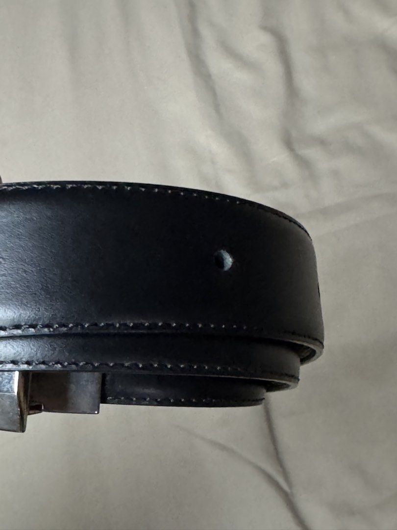 Dunhill Black Leather Belt with Silver Buckle (Category: Belts) located in Manila. Submitted by seangoart (Listing ID 1465530674, Image 3). Description: - Brand: Dunhill - Material: Premium black leather with classic stitched edges - Hardware: Silver-tone metal buckle with black insert and engraved logo - Fit: Standard waist size with traditional punch holes - Style: Versatile design, perfect for formal suits or casual trousers - Condition: Excel