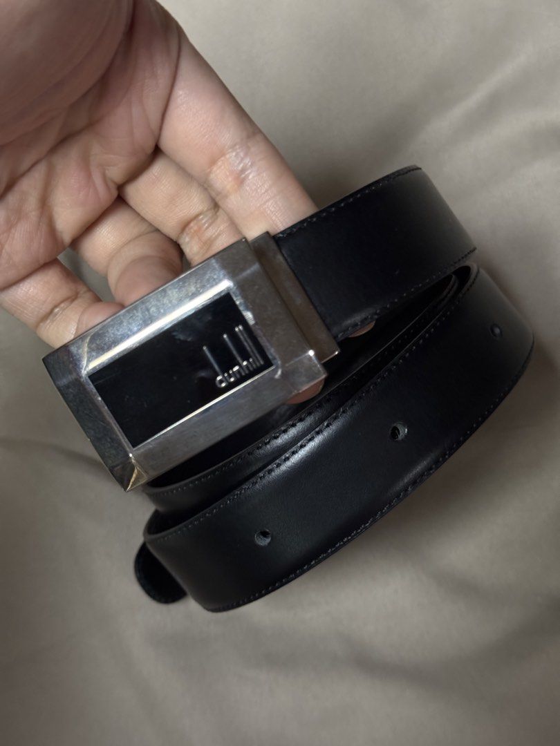 Dunhill Black Leather Belt with Silver Buckle (Category: Belts) located in Manila. Submitted by seangoart (Listing ID 1465530674, Image 1). Description: - Brand: Dunhill - Material: Premium black leather with classic stitched edges - Hardware: Silver-tone metal buckle with black insert and engraved logo - Fit: Standard waist size with traditional punch holes - Style: Versatile design, perfect for formal suits or casual trousers - Condition: Excel
