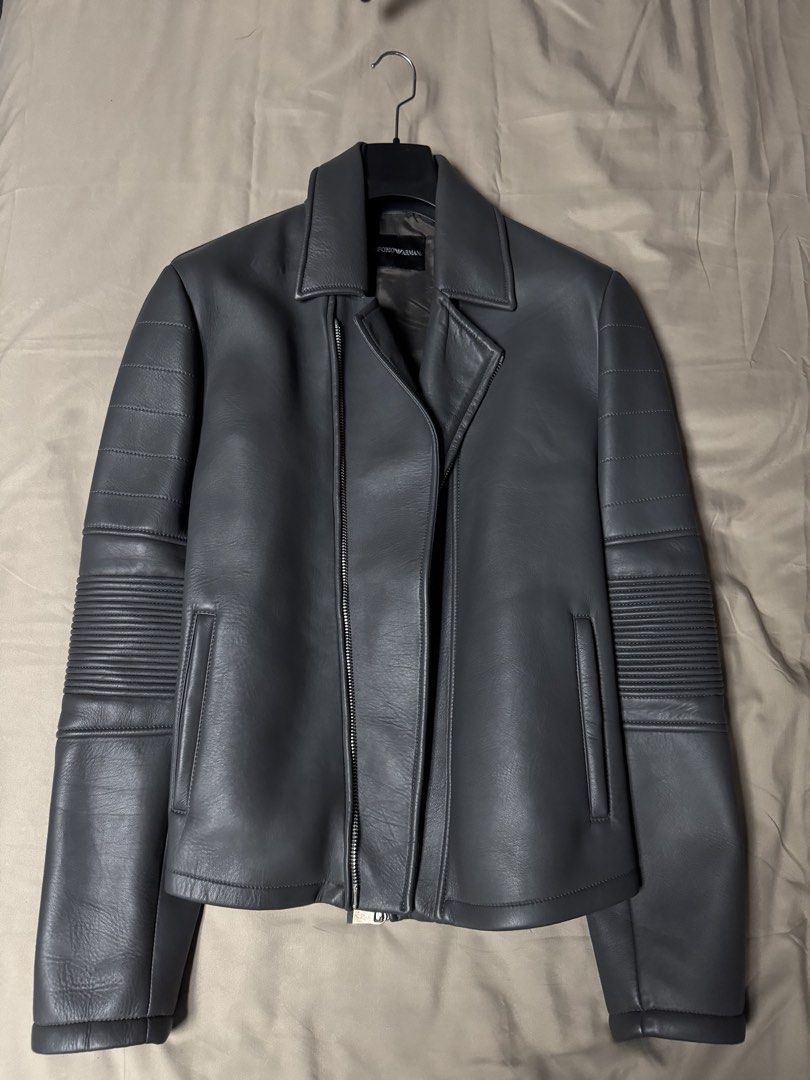 Emporio Armani Grey Leather Biker Jacket (Category: Coats, Jackets and Outerwear) located in Manila. Submitted by seangoart (Listing ID 1465502392, Image 1). Description: - Authentic Emporio Armani leather biker jacket in a versatile grey shade - Edgy asymmetrical front zip closure - Stylish quilted ribbed detailing on sleeves and shoulders - Two lower front zipped welt pockets for daily essentials - Fully lined interior with original brand label