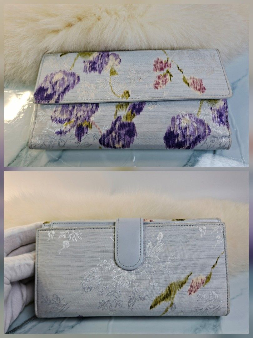 En Quête Floral Long Wallet Light Blue (Category: Wallets & Card holders) located in Pasay City. Submitted by onick_79 (Listing ID 1465506110, Image 3). Description: - Brand: en quête collection - Color/Design: Light blue with purple and white floral pattern - Features: Multiple card slots, bill compartments, secure snap button closure with front strap - Condition: Brand new with original price tag still attached - Perfect for organizing your car