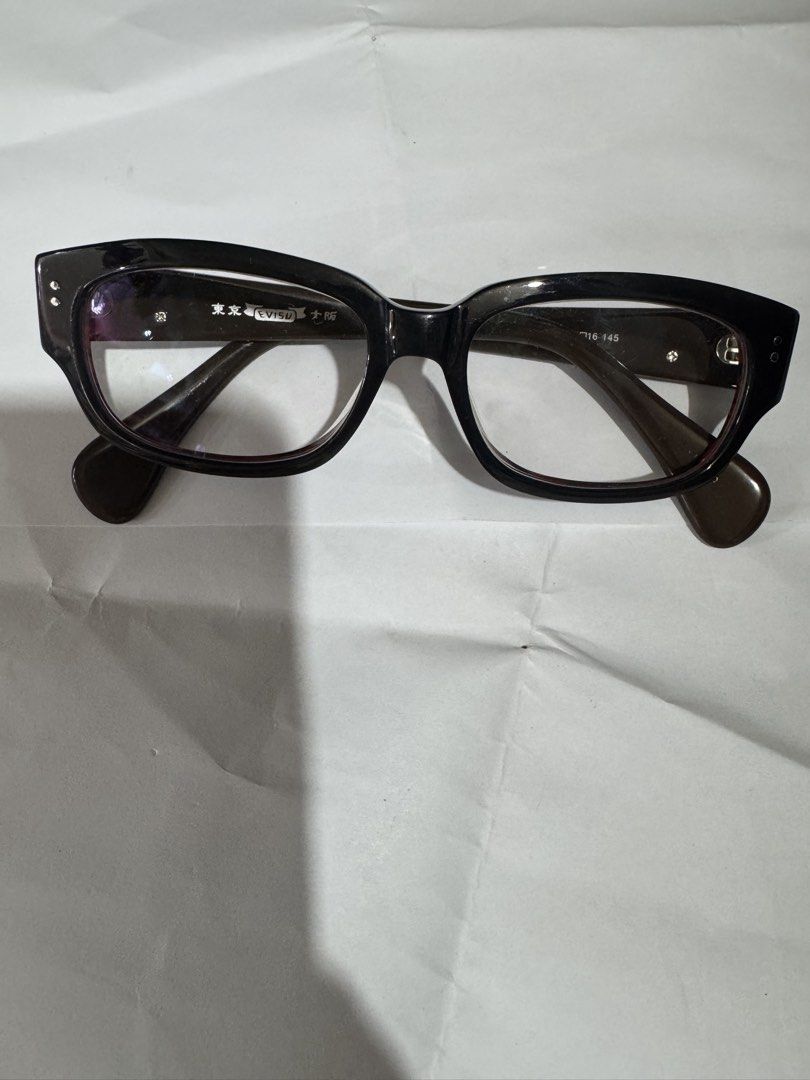 Evisu EVH-8129 Eyeglasse 100% Genuine (Category: Sunglasses & Eyewear) located in Manila. Submitted by wildbear.e10374 (Listing ID 1465422352, Image 2). Description: - Brand: Evisu - Model: EVH-8129 - Colorway: Dark brown and red tortoise shell pattern with signature white seagull logos - Details: Tokyo Osaka branding printed inside the temple arm - Size: 53-16-145 - Hardware: Sturdy metal hinges - Condition: Well-maintained, frame only (ready fo