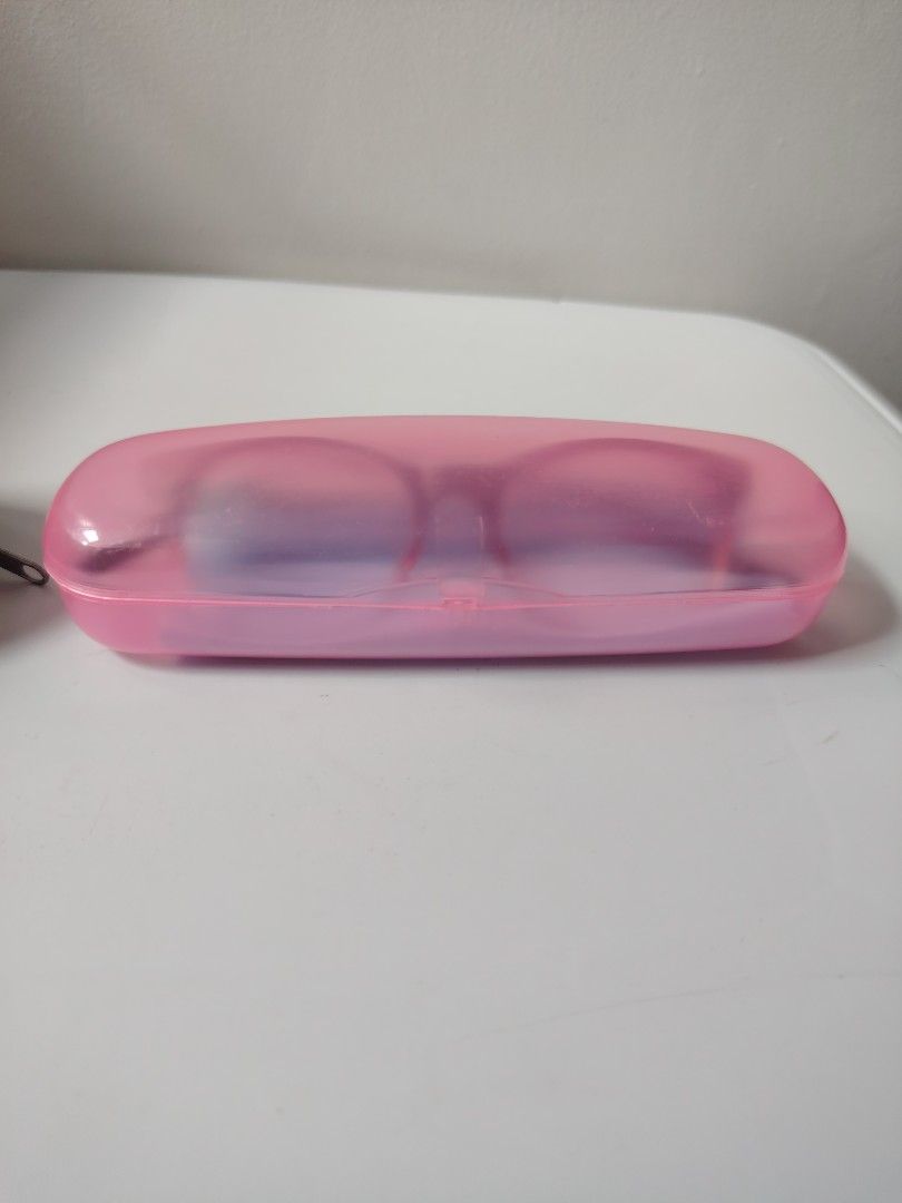Executive Optical eyewear with cases (Category: Sunglasses & Eyewear) located in Antipolo. Submitted by goodsinger (Listing ID 1465574920, Image 2). Description: - 2 pairs of glasses included: 1 black round frame and 1 red-to-clear gradient plastic frame - Set 1: Comes with a beige EO zip case (70% recycled material) and yellow cleaning cloth - Set 2: Comes with a pink translucent hard case and blue cleaning cloth - Both pairs feature protective 