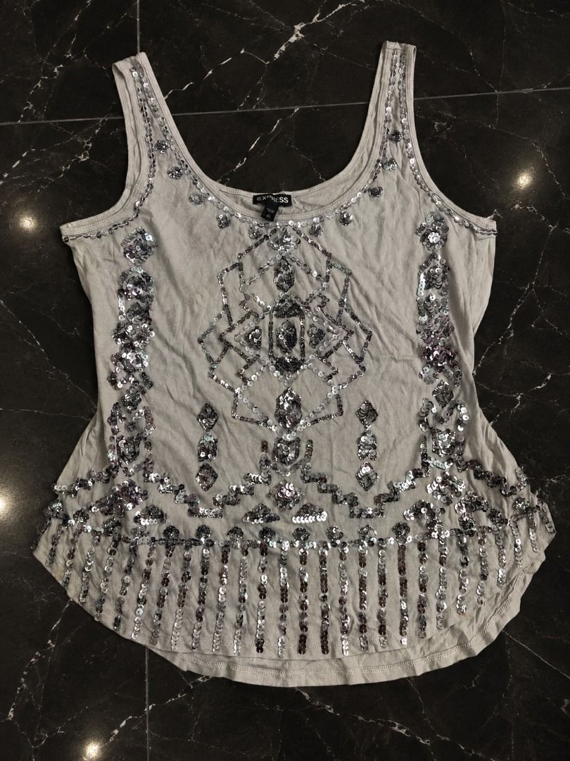 EXPRESS Embellished Sequin Tank Top (Category: Sleeveless) located in Manila. Submitted by sakki.ph (Listing ID 1465481907, Image 1). Description: Beautiful EXPRESS embellished tank top with intricate silver sequin and bead detailing throughout. NEED WASH. Brand: EXPRESS Size: freesize Needs washing/cleaning. There are some visible stains/marks, but I have not washed the item yet, so I’m unsure if the stains will come out after washing. so please
