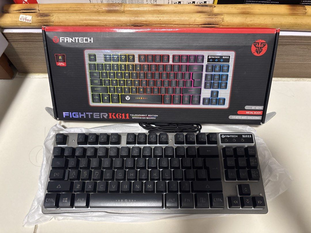Fantech Fighter K611 Tournament Edition Gaming Keyboard (Category: Computer Keyboard) located in Manila. Submitted by silentdeer.537e56 (Listing ID 1465423620, Image 1). Description: - Model: Fantech Fighter K611 Gaming Keyboard (87 Keys Tournament Edition) - Build: Sturdy metal body construction with 19 keys anti-ghosting - Condition: Like new, plastic wrapping still attached to the keyboard base - Inclusions: Complete with original box and neat