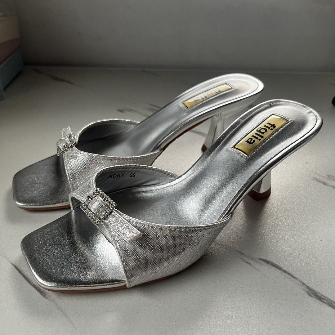 Figlia Rory Silver Heel Slides Sandals (Category: Heels) located in Cebu City. Submitted by submariene (Listing ID 1465442443, Image 3). Description: Figlia Rory Size 35 Heel Slides - used twice for events only - no visible flaws (like new) - 2.5 inch heel - perfect for elegant night outs - with box - originally bought for ₱1799 in SM Store last September .